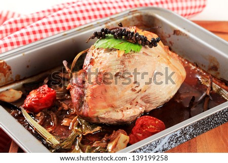 Pork shoulder roasted with vegetables