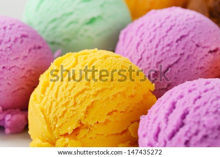 Group of ice cream scoops on a rectangular white plate