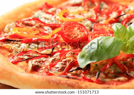 Vegetable pizza on white cutting board