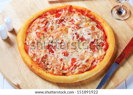 Pizza Margarita on a cutting board