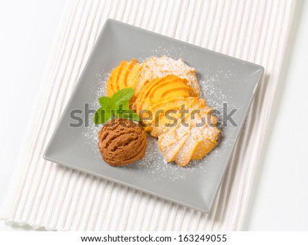 Spritz butter cookies with scoops of ice cream