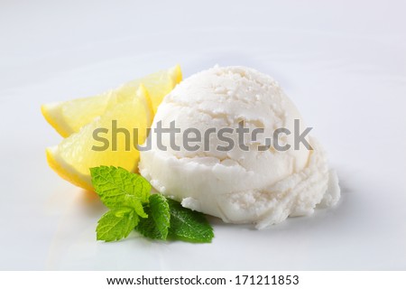 Scoop of lemon ice cream with fresh berries
