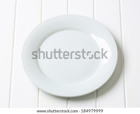Single white clean porcelain plate