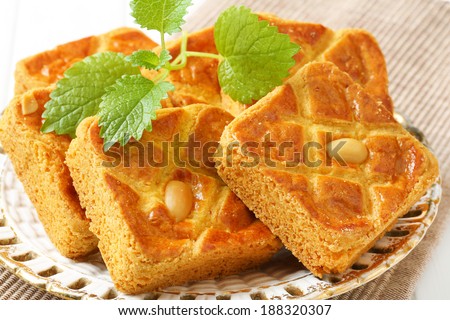 Small square cakes filled with thick almond paste