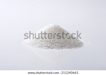 Heap of sugar on white background