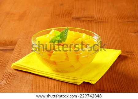 Canned pineapple in a glass bowl