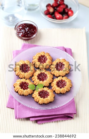 Chocolate dipped butter cookies with jam center