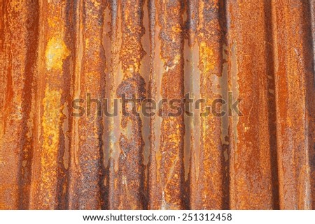 Old corrugated metal sheet covered with rust