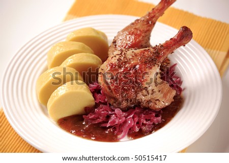 Roast duck, red cabbage and potato dumplings