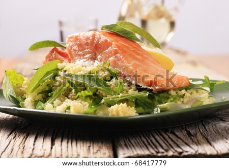 Slow roasted salmon fillet on a bed of couscous salad