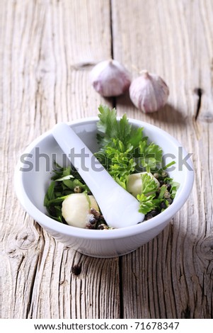 Mortar and pestle with ingredients ready to be ground