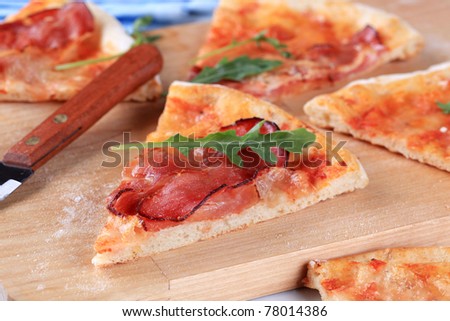 Slices of pizza prosciutto