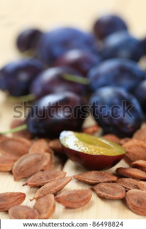 Ripe damson plums and stones