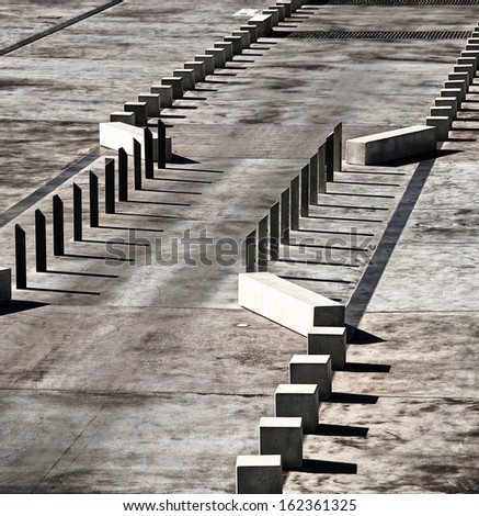 View of concrete traffic control barriers creating abstract patterns