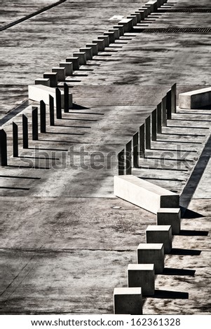 View of concrete traffic control barriers creating abstract patterns