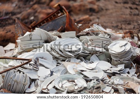 Piles of crockery amongst the ruins of a community hall destroyed by bushfire
