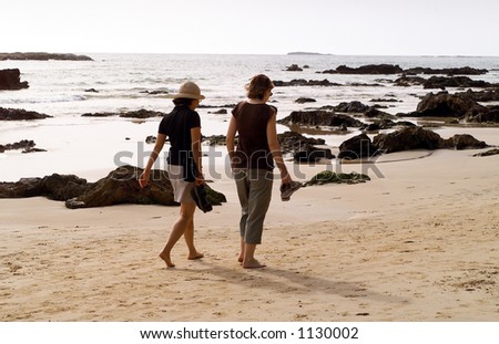 Two women going for a morning walk on the beach