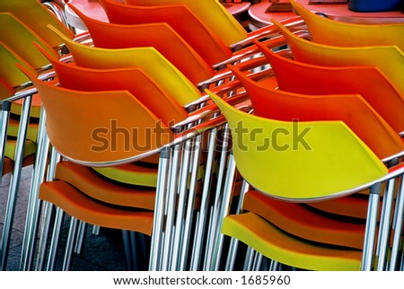 Stack of Plastic and Steel chairs