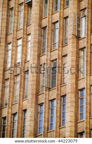 Detail of beautiful old building with several metal windows open