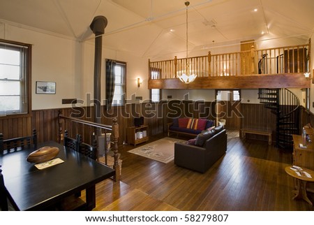 Interior views of a timber house, with polished timber floors