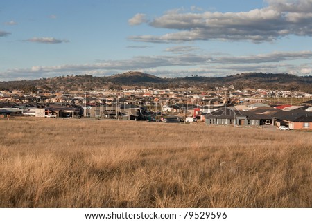 View from a hill overlooking very typical Australian urban sprawl in a new housing estate
