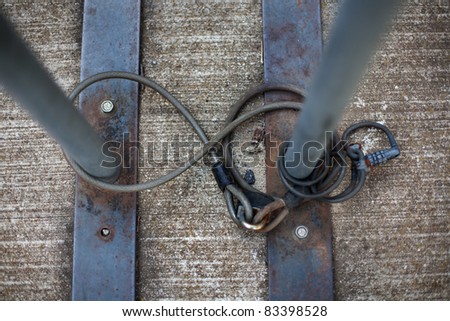 View looking straight down onto cables and locks for securing a bicycle to a bike rack
