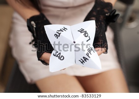 Folded paper word game known as Chatterbox, Cootie Catcher, Fortune Teller, Salt Cellar or Whirlybird