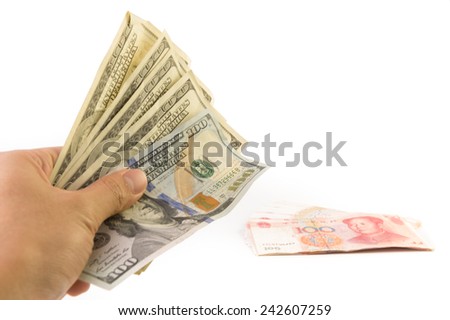 US Dollar bank notes in hand and China bank note on ground with White Isolate Background