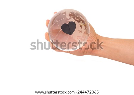 Crystal globe with Black heart in hand on White Isolate background