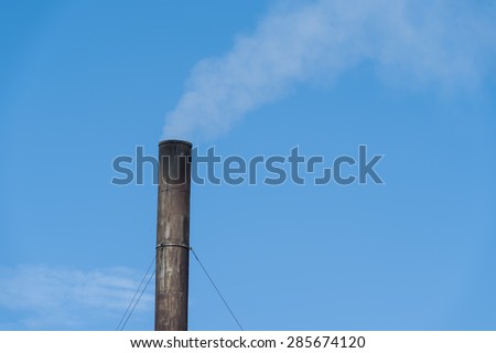 Old Factory plant with clear blue sky and cloud.