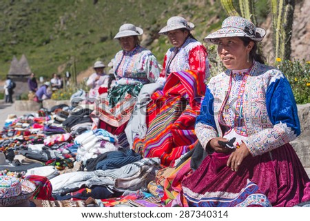 19 APR 2015 : Local Peruvian try to sell Handicraft\'s product at Condor watching, Colca Canyon, Arequipa, Peru