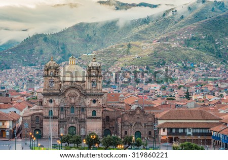 Morning sun rising with a group of could  at Cathedral of Santo Domingo, Plaza of Cusco city, Peru