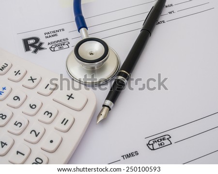 Health care costs. Stethoscope and calculator. Concept for health care costs or medical insurance.
