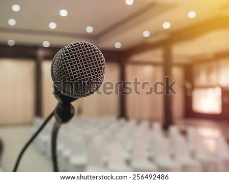 Microphone in  conference room with defocused bokeh lights in background. Extremely shallow dof. : Vintage style and  filtered process