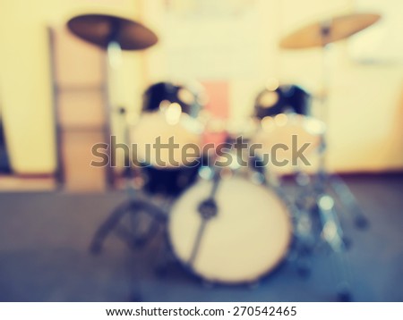 Abstract blurred  music instruments in empty  recording studio  for background. Vintage style photo.