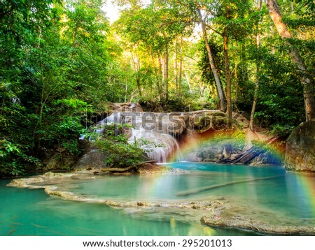 A beautiful waterfall with rainbow in deep forest of Erawan National Park in Kanchanaburi Province , Thailand