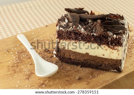 Chocolate Mousse Cake  with white spoon - focus on cake