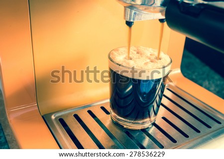 Espresso machine brewing a coffee - filtered process