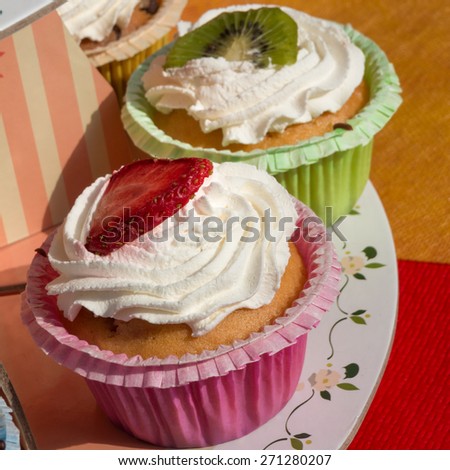 kiwi and strawberry dessert fruit tart pastry with whipped cream, dessert cake