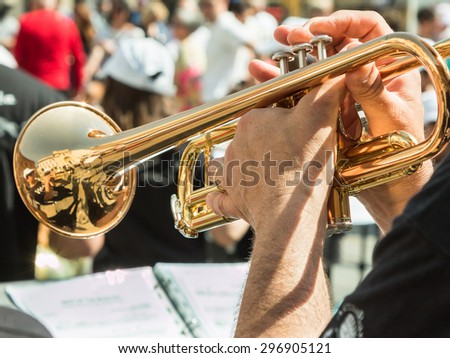 Beard Man Playng Brass Lacquered Trumpet during Outdoor Concert