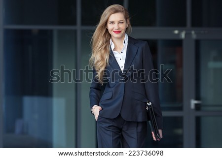 business woman with a folder on the background of the business center