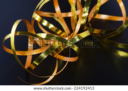 Gold-colored gift-wrap ribbon, close-up