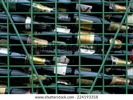 Rack of empty wine bottles, full frame