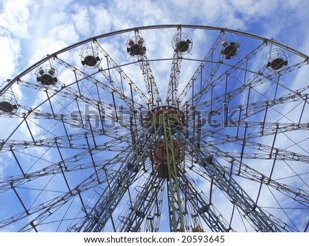 Wheel of review in park on blue sky background