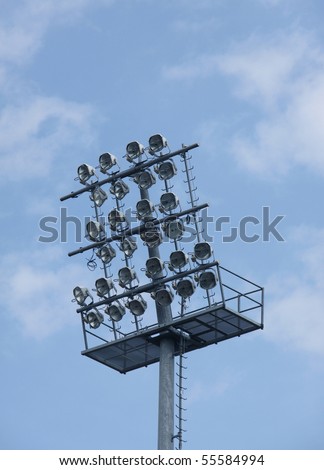 Football stadium lights on blue sky