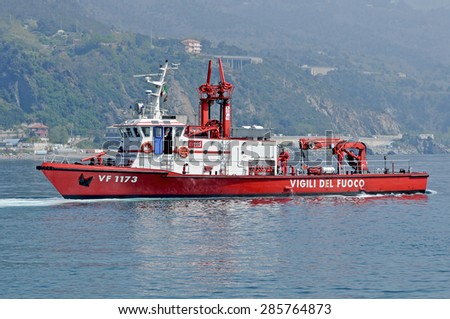 Genoa, Italy - may 20, 2014 - A patrol boat of the fire moves in the sea of Arenzano, near the spot where the wreck of the tanker Haven.