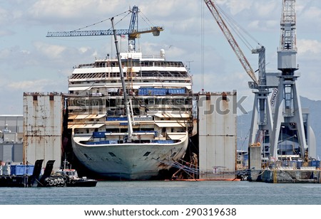 Genoa, Italy - may 28, 2015 - The wreck of Costa Concordia is demolished in dry dock at the shipyard San Giorgio.