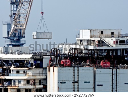 Genoa, Italy - July 2, 2015: the wreck of Costa Concordia is demolished in dry dock at the shipyard San Giorgio.