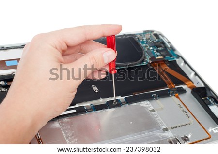 man repair laptop with screwdriver