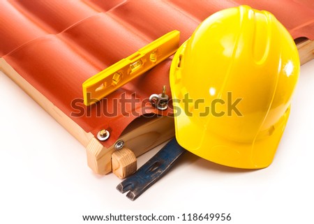 Roof made Ã?Â¢??Ã?Â¢??of polycarbonate, a working safety helmet and a water level on a white background
